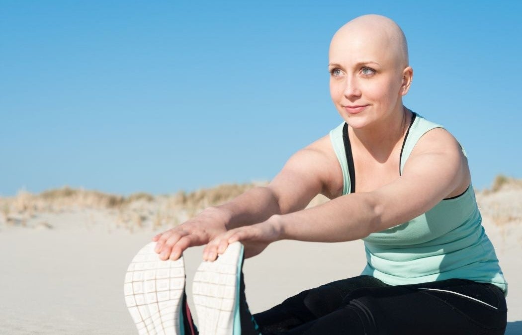 Person stretching legs during a workout outdoors.