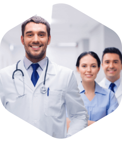 Group of medical professionals standing together in a clinical setting.